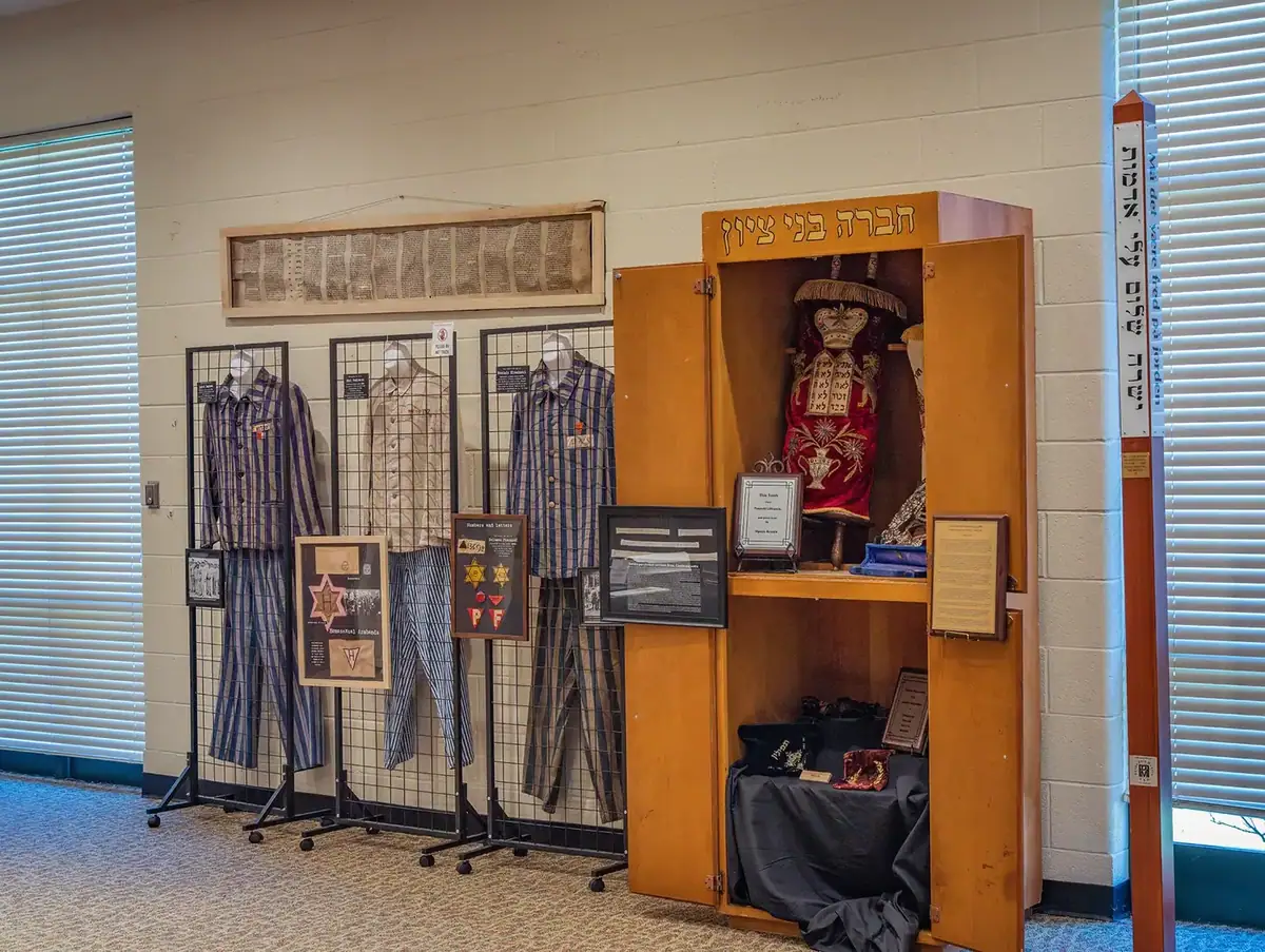 Holocaust memorial exhibit at Whitwell Middle School with prisoner uniforms and artifacts
