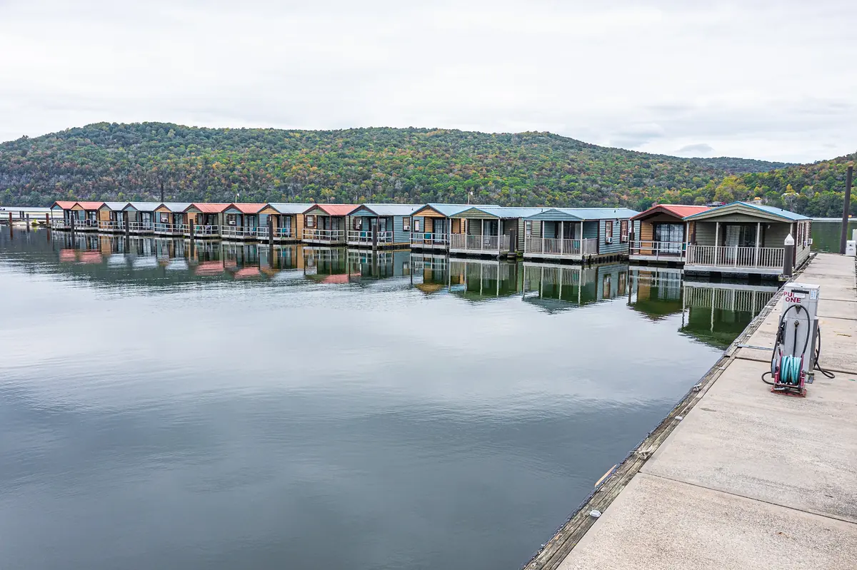 Floating cabins reflected in the water at Hales Bar Marina