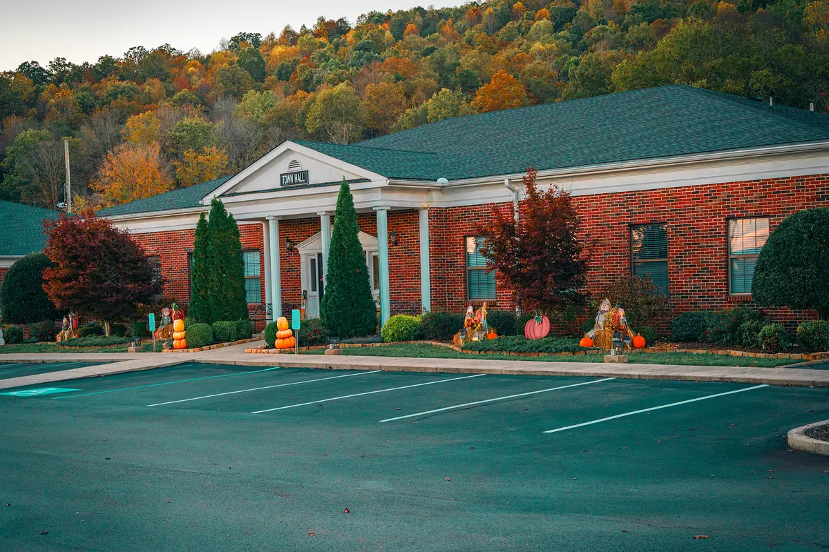 Kimball Town Hall with a fall hillside behind