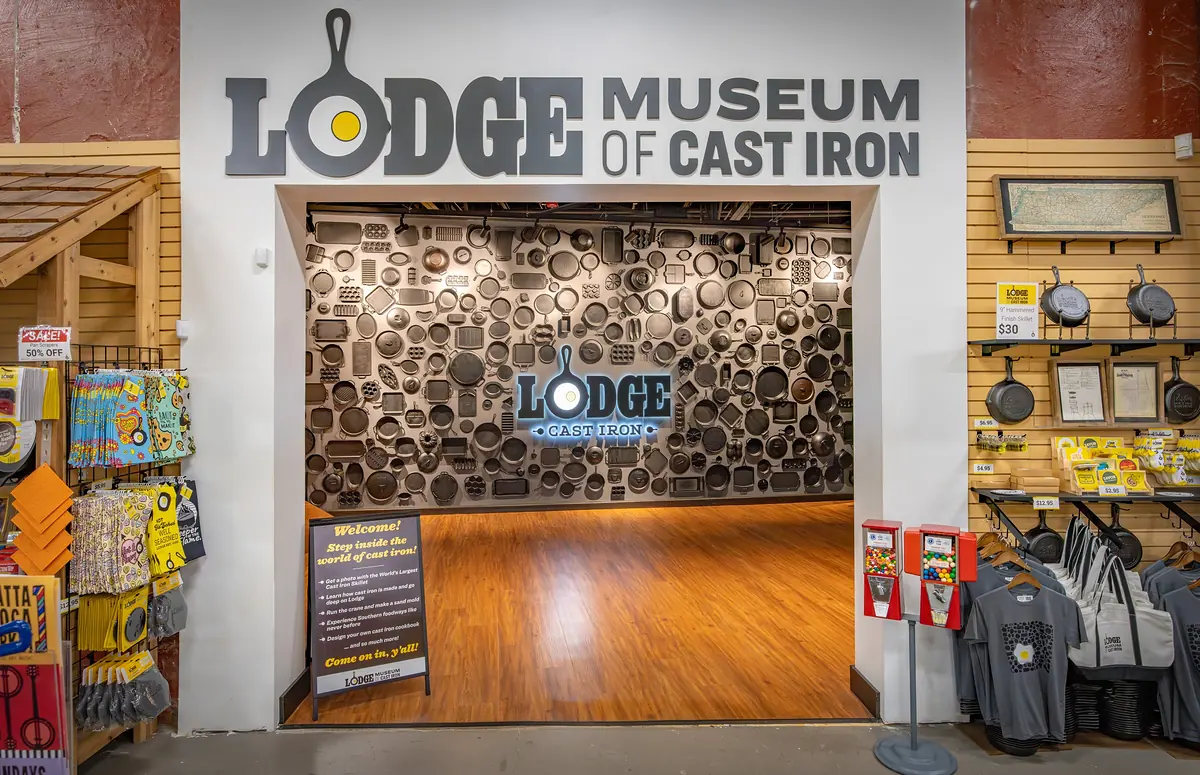 Entrance to the Lodge Museum of Cast Iron with a wall of skillets