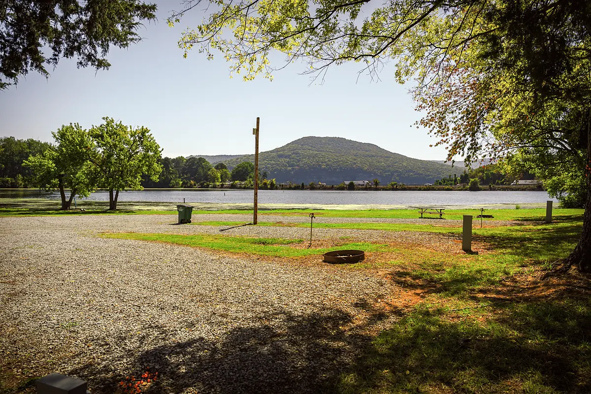 Lakeside campsite with a fire ring at Marion County Park