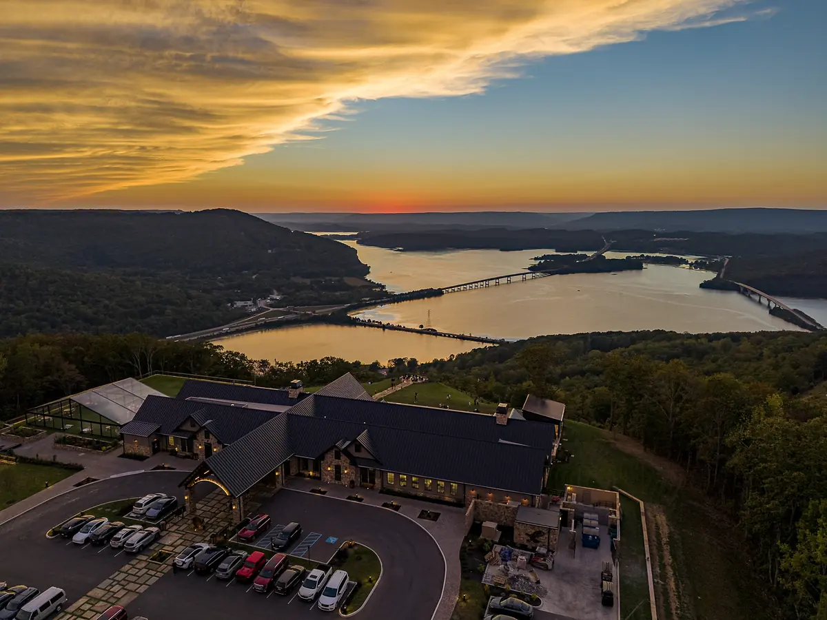 Riverdance lodge roofline at sunset with Nickajack Lake and the bridges beyond