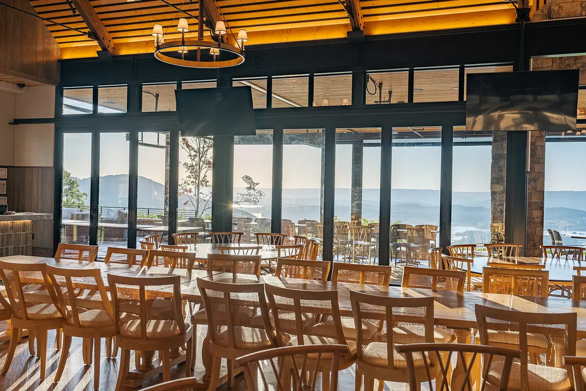 Riverdance dining room with glass doors open to the gorge view