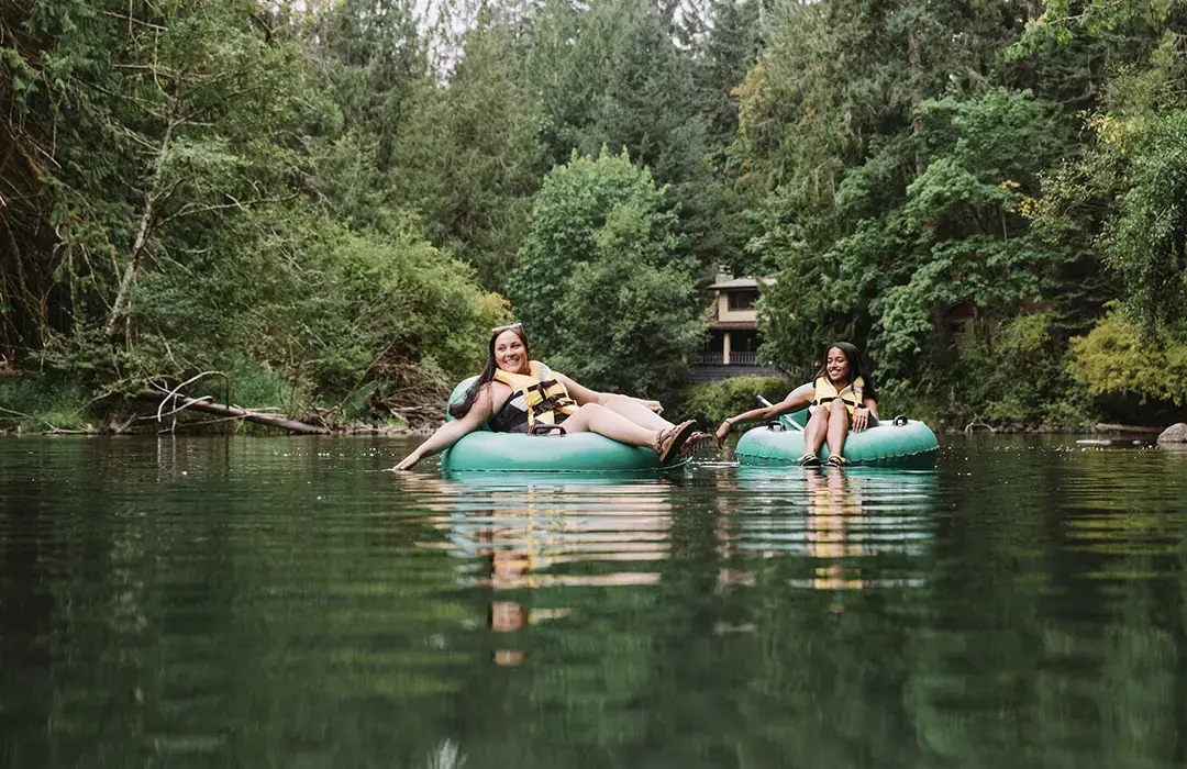 Two people floating on inner tubes